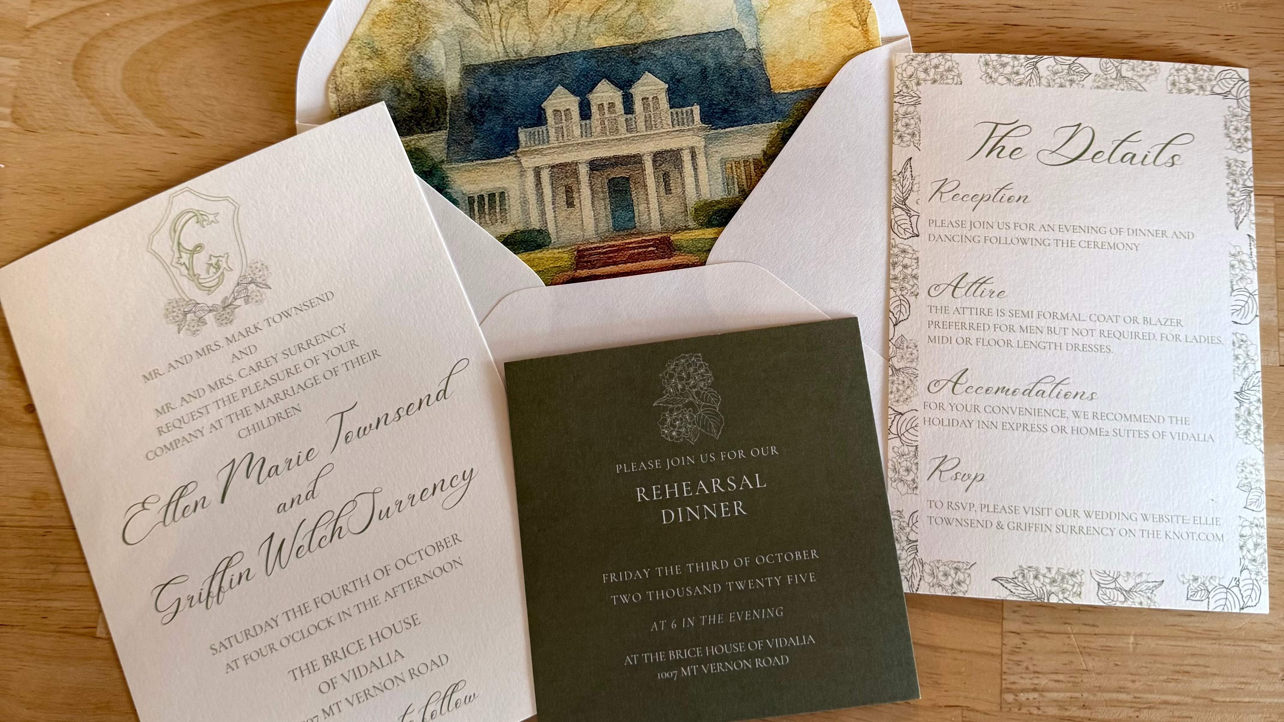 Wedding invitation set with envelope featuring a painting on a wooden surface